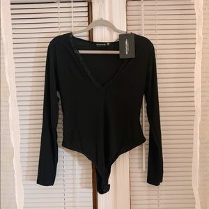Black Pretty Little Thing Bodysuit in size 12